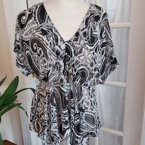 TUNIC-ASYMMETRICAL HEM AND PATTERN